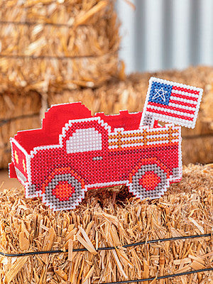 Just CrossStitch Magazine: 2025 Summer Edition. Old Red
Design by Frony Ritter of Frony Ritter Designs
Create this 3-D truck design featuring a patriotic flag in its bed, with interchangeable motifs to adapt the cargo as the seasons change.