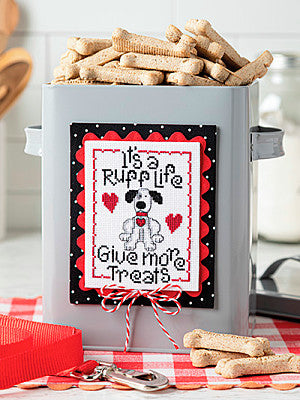 Just CrossStitch Magazine: 2025 Summer Edition. Ruff Life
Design by Charlene Howard Blank of Tranquiltree Designs
Your furry friend will love you forever when you stitch and then follow this very important sentiment! Attach to a treat can for a fun and easy finish.