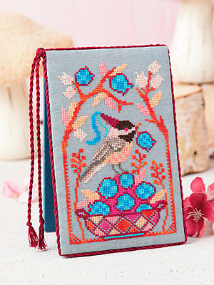 Just CrossStitch Magazine Summer 2025 Edition. Blueberry Harvest Design by Jessica Doizé.
A sweet little chickadee delights in the summer harvest. Step into her whimsical world, where beautiful hues and delicate patterns abound.