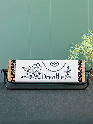 Just CrossStitch Magazine: 2025 Summer Edition. Breathe
Design by Barbie Laux of Twisted Willow Designs
Inspired by a simple pencil sketch, this basic design offers a relaxing stitch for any skill level. Display it where a quick glance will gently remind you to take a breath and embrace its calming message.