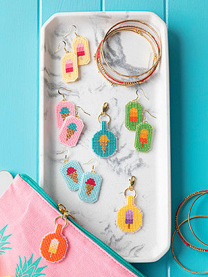 Just CrossStitch Magazine: 2025 Summer Edition. Cool Treats
Designs by Kathleen Berlew
These sweet treats make cool summer accessories. Use small pieces of plastic canvas and scraps from your floss stash to stitch earrings and zipper tabs in your favorite flavors.