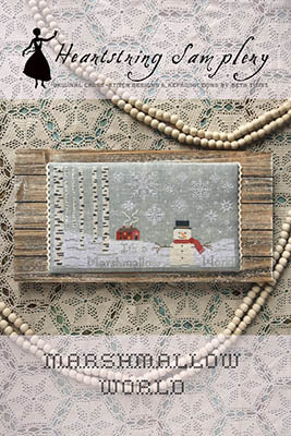 Horizontal winter-themed cross stitch design with a snowman, snowfall, and the words Marshmallow World, stitched in soft neutral tones, by Heartstring Samplery.