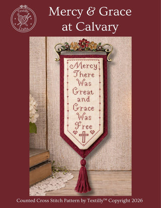 Cross stitch pattern featuring the hymn phrase “Mercy there was great and grace was free” in a vertical banner design with a cross motif and tassel at the bottom