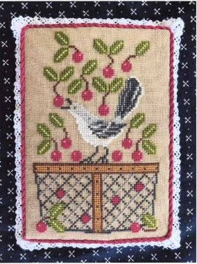 Decorative needlepoint with a bird and floral design on a textured background