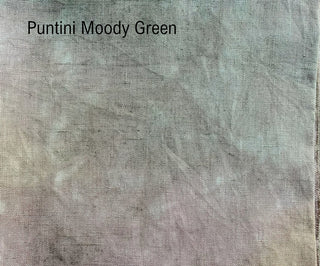 A close-up fabric texture swatch labeled 'Puntini Moody Green' in black text at the top left, showing a muted sage-green and gray woven material with soft tonal variation.