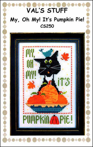 Cross-stitch design featuring a wide-eyed black cat behind stacked pumpkins in a blue pie dish, surrounded by falling autumn leaves with the phrase “my, oh my! it’s pumpkin pie!” stitched above.