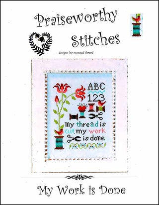Cross stitch sampler featuring a floral vine, birds, alphabet and numbers, and the phrase “my thread is cut, my work is done” stitched in soft colors on a light background with a decorative border.
