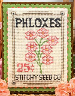 Cross-stitched design of a seed packet with pink flowers and text, featuring the brand 'Stitchy Seed Co'.
