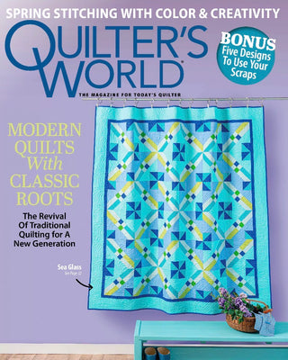 Cover of 'Quilter's World' magazine featuring a modern quilt with classic roots on a purple background.