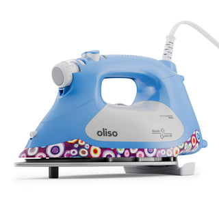 Blue and gray Oliso iron with colorful design on the soleplate against a white background