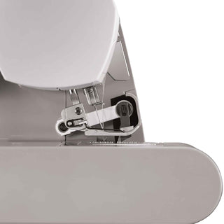 Close-up of a sewing machine needle and presser foot on a white background