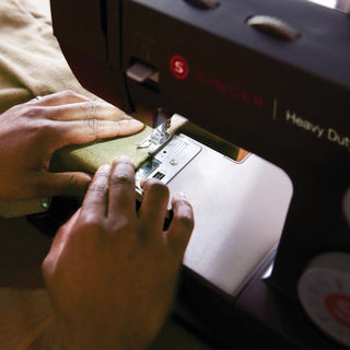 SINGER® Heavy Duty 4432 Black – on sewing workspace