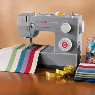 SINGER® 4432 Heavy Duty – displayed on sewing table