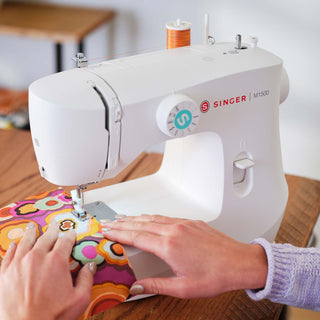 SINGER® M1500 – displayed on sewing workspace