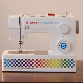 SINGER® PRISMA Heavy Duty – displayed on sewing table