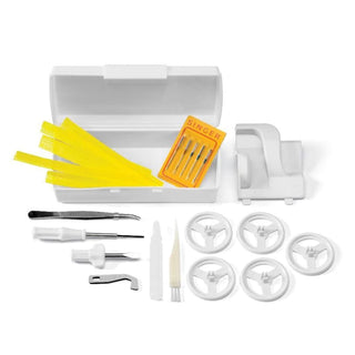 Sewing machine accessory kit with various parts on a white background