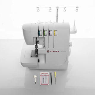 Singer overlock machine with accessories on a white background