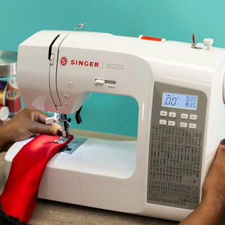SINGER® SC220 Sewing Machine – displayed on sewing table