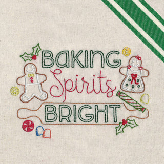 Embroidered text 'Baking Spirits Bright' with gingerbread men and holly on a beige background.