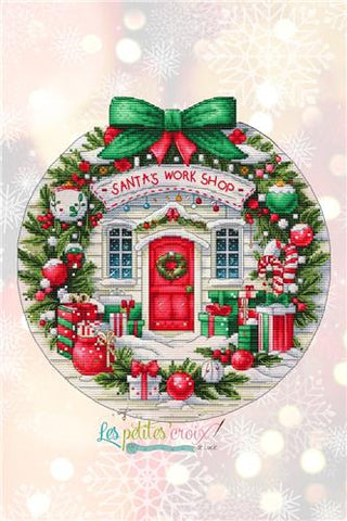 Decorative image of Santa's Workshop with Christmas elements and 'Les Petites Croix' branding.