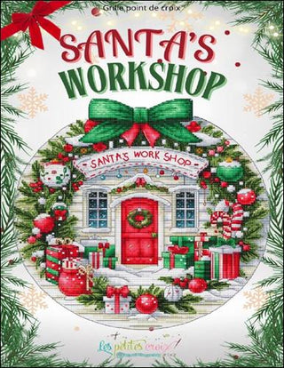 Cover of a cross-stitch pattern book titled 'Santa's Workshop' with festive design and text.