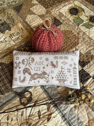 Sassy Squirrel Pinkeep | Cross Stitch Pattern by Pansy Patch Quilts and Stitchery