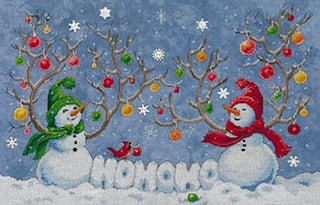 Two snowmen wearing red and green knit hats and scarves, with a red cardinal perched on snowy branches decorated with ornaments, and the text ‘HOHOHO’ below.