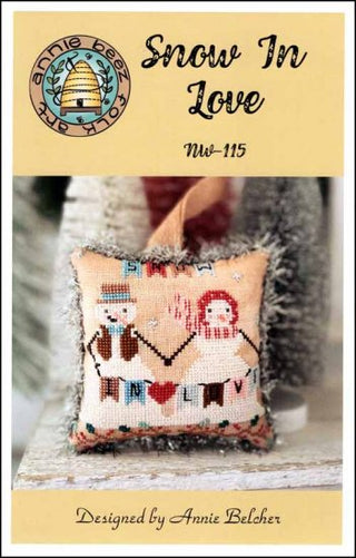 Cross stitch pattern depicting a snowman and hearts on a vintage style background, titled 'Snow In Love' by Annie Beez Folk Art.