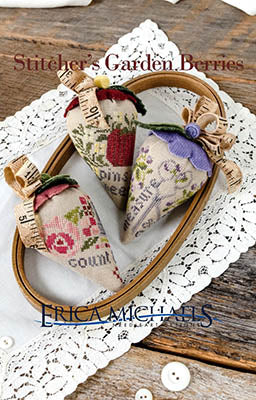 Stitcher's Garden Berries cross stitch pattern by Erica Michaels featuring three berry-shaped designs with pincushion, scissors, and thimble motifs accented with florals and stitching phrases.
