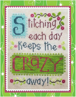 Cross stitch design on light colored fabric stating, "Stitching each day keeps the crazy away"