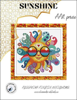 Colorful sun design with sunglasses on a cross-stitch pattern, featuring the brand 'Alessandra Adelaide Needleworks'.