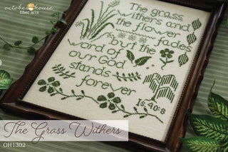 Embroidery with text and floral patterns, framed in a wooden border.