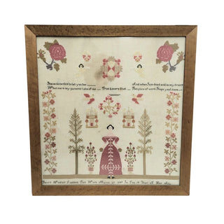Framed sampler with floral patterns and text on a white background