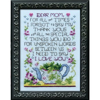 Cross-stitched piece with a teapot design and text
