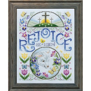 Cross-stitched design with 'Rejoice He is Risen' text and Easter elements in a wooden frame.