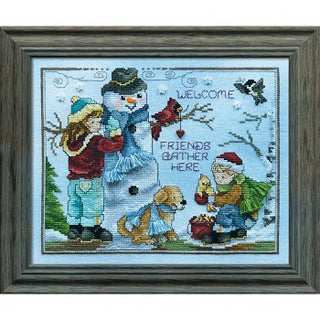Cross-stitched picture of a snowy scene with characters and text, framed.