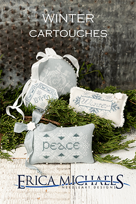 Winter Cartouches cross stitch pattern by Erica Michaels featuring soft blue-gray winter motifs, cartouche designs, and the word peace in a primitive folk style.