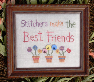 Cross stitch design with the phrase “Stitchers make the Best Friends” and colorful potted flowers with pastel button accents.