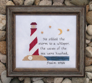 Cross stitch pattern with red-and-white lighthouse, moon, stars, and Psalm 107:29 Scripture about God calming the storm.