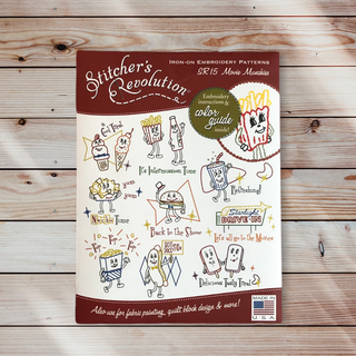 A pattern-sized, iron-on embroidery transfer pattern packet for movie-themed designs, with color guide and stitch guide.