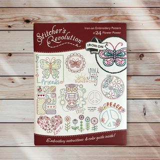 Stitcher’s Revolution SR24 Flower Power iron-on embroidery transfer pattern with flowers, butterflies, and peace sign motifs