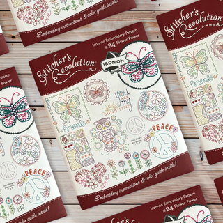 Stitcher’s Revolution SR24 Flower Power iron-on embroidery transfer pattern with flowers, butterflies, and peace sign motifs